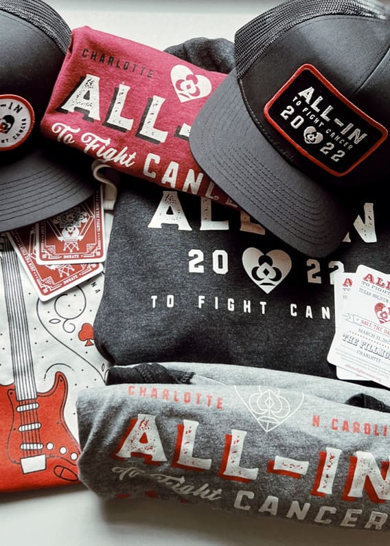 Shirts, hats, and other swag promoting All-In